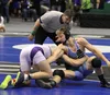 Chugiak senior Dawson Budke works for a reversal during the 170-pound final of the ASAA/First National Bank 4A State Wrestling Championships Saturday at the Alaska Airlines Center. Budke earn