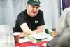 Tundra cartoonist Chad Carpenter signs autographs and visits with fans at the 2015 Mat-Su Outdoorsman Show at the Curtis D. Menard Memorial Sports Center, 1001 S. Mack Dr., in Wasilla. The an