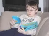 GREG JOHNSON/Frontiersman Andrew Dufresne, 11, reclines on a
couch in a quiet corner of the Boys and Girls Club of Mat-Su on
Monday afternoon.