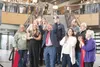 Mat-Su Borough School district superintendent Dr. Randy Trani throwing his hands up in celebration after the ribbon cutting at the new Mat-Su Central in 2025. J. David McChesney/Frontiersman