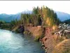 Chunks of asphalt are ready to crumble into the river in one photo taken in Circle View Subdivision this summer. Homeowners are continuing a battle to obtain funding to address erosion proble