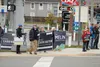 Palmer Councilman Brian Daniels holds signs for Julie Berberich and Lee Henriksen alongside Steve Carrington and Pam Melin Tim Rockey / Frontiersman