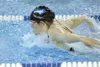Frontiersman file photo Palmer senior Stephanie Miner rises
above the water in a 200-yard medley event during her junior
season. Miner is the top returner on the Moose girls’ team
according t
