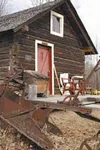 The Reedy Cabin, built in 1915 and transported to Heaven's farm
where it was restored, today is occasionally used by a local Boy
Scout troop that monitors birdhouses placed on nearby trees. P