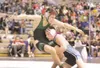 ROBERT DeBERRY/Frontiersman Colony Knight Aaron Boss gets taken
down by Soldotna Star Wes Mills during Friday's semi final match in
the 135 lb. weight class.