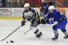Soldotna’s Wyatt Medcoff (left) attempts to clear the puck from Palmer’s Alex Nelius Thursday at the Soldotna Regional Sports Complex. Photo by Joey Klecka/Peninsula Clarion