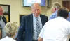 Alaska Gov. Bill Walker greets people in the audience after completing his address to the Mat-Su Borough Assembly on Tuesday night in Palmer. MATT HICKMAN/Frontiersman
