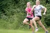 JEREMIAH BARTZ/Frontiersman Colony sophomore Audrey Michaelson,
right, sprints past Wasilla junior Morgan Dampier during the final
stretch of the girls’ event of the Colony Twilight cross cou