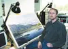 Shane Lamb works on his latest painting, which features the
Alaska Railroad, a subject Lamb is tackling for the fourth time.
Photo by CASEY RESSLER/Frontiersman.