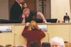 In this file photo from a January hearing on a proposed gun range, Big Lake resident Jeff Moreiko introduces himself to Mat-Su Borough Assemblyman Dan Mayfield, unintentionally illustrating t