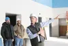 Chris Wittington-Evans with Wolf Architecture points out features of the auditorium at the new Mat-Su Day School during a tour of the under-construction facility Tuesday. The school will cost