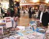 Tundra cartoonist Chad Carpenter signs a book for Roxanne
Mushrall at the Book Bonanza last Saturday. Photo by RINDI
WHITE/Frontiersman.