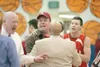 ROBERT DeBERRY/Frontiersman Members of the Wasilla basketball
team hold back a unidentified adult after the Wasilla vs. Palmer
basketball game Tuesday at Palmer high School.