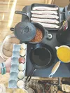 Farm-fresh eggs, bacon, sweet corn and baked beans are on tonight’s stove-cooked meal. Kyle Wilkinson/For the Frontiersman