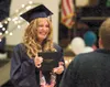 American Charter 2011 graduate Leah Thompson shows her excitement as she walks off stage with her diploma. ROBERT DeBERRY/Frontiersman