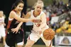 Wasilla senior guard Alexis Imoe battles for the ball against Juneau’s Kymberlee Kelly during quarterfinal competition at the ASAA/First National Bank 4A State Basketball Championships at the