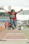 (ROBERT DeBERRY/Frontiersman) Iditarod Elementary fourth-grader
Austin Schnekenburger, 10, extends his arm for maximum distance in
the long jump event at Saturday's elementary track meet at P