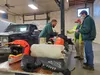 McGrath residents Barney Anselment and Amos Cruise wrap up their tech inspection in Wasilla on Wednesday, Feb. 10. Jacob Mann/Frontiersman
