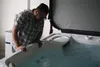 Marine Corps veteran Angelo Maddaloni looks at his new hot tub, provided by Arctic Home Living. Jacob Mann/Frontiersman