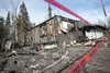 Red danger tape surrounds this duplex on Sullivan Avenue and Julie Marie Circle that burned Thursday. The late afternoon blaze displaced two families. ROBERT DeBERRY/Frontiersman.com
