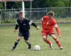 Wasilla's Loren Smith (above) tries to take control of the ball
during the second half of the Warriors' 4-0 victory over Colony in
the third-place match of the ASAA State Soccer Tournament on