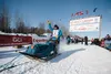 Ramey Smith waves goodbye as he races down the chute. David Poyzer/Iditarod