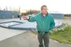 ROBERT DeBERRY/Frontiersman Wasilla Public Works Director Archie
Giddings talks about the forced main system for waste treatment
that is used by the city. Behind Giddings is a sludge digester