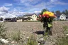 On Friday, June 3, 2016, a bouquet of flowers sits near the intersection where a 33-year-old Wasilla man was shot by Alaska State Troopers. The man, Joshua Smith, died on Friday at an Anchora