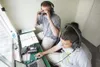 Mat-Su Miners announcers Dale Long, top, and Aaron Watson get
into the game Thursday night at Hermon Brothers Field in Palmer.
Long and Watson traveled from Indiana State University to broadc