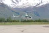 A pilot hovers his Robinson R44 helicopter just above the tarmac at the Palmer Municipal Airport in this 2010 file photo. The city reports it is close to fixing problems with its airport that