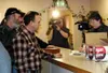 Recall committee members Ed Tompkins, left, and John Vinduska,
along with Anchorage television camera crews, look on as Carol
Thompson, the Alaska Division of Elections Region 2 supervisor,
c