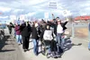 Richard Dale rolls out front at a rally in the Valley Friday at Newcomb Park on Wasilla Lake to support Medicaid expansion. He’s flanked by Devon Paasch and Nicole Towne. About 80 people atte