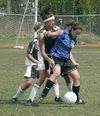 Palmer's Katy Applin and Colony's Kristina Klapperich battle for
the ball during Colony's 2-1 win over Palmer in the girls' Region
III championship game on Saturday. Photo by JEREMIAH BARTZ/
