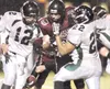 MICHAEL PENN/Juneau Empire Colony quarterback Collin Murphy,
left, tries to recover a fumble during the Knights’ 20-6 loss to
Juneau-Douglas on Friday.