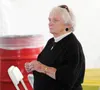Helen Munoz watches Gov. Bill Walker speak at the Alaska State Fair last Wednesday. (MATT HICKMAN/Frontiersman)