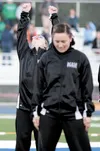 Mat-Valley Dance Super Star Sam Galyean raises his hands while the crowd cheers for the Valley dance group during a halftime show at the Palmer High School football game Friday evening at Mac