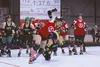 The Denali Destroyer Dolls' Erika "Dolla Billz" Bills goes down and takes her opponent with her in an attempt to stop one member of the North Pole Babes in Toyland from escaping around the tr