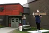 Palmer High School incoming senior Annika Gagnon and Mat-Su Career and Technical High School student Gloria Shomer participate in a rally at the Mat-Su Borough School District office prior to