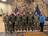 Members of the Germany Army pose for a photograph with U.S. Army soldiers during a brief stop at Fort Greely. The representatives of the Bundeswehr are visiting Alaska to enhance relationship