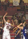Wasilla's Tonya James puts in a shot for two points during
Friday's game against the Palmer Moose. TIM BRODT/Frontiersman