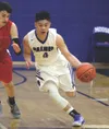 Palmer freshman Dae Osiensky runs the ball down the floor during a 58-36 win over Anchorage Christian School Jan. 7 2017, at Palmer High School. The Moose boys and girls were at Colony Tuesda