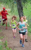 Two-time women’s champion Sienna Carey, 12, leads early in the sixth annual Red Shirt Lake Trail June 1 at Nancy Lake State Recreation Area near Willow. Behind her are her sister, Shine Carey