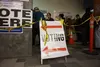 Voters line up in the lobby of Anchorage's City Hall on Monday, with most waiting 90 minutes to two hours that morning to cast their ballots at the early voting site there. Early voting in Al