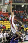 Wasilla’s Dane Kuiper goes for a dunk during Wasilla’s win over the Lathrop Malemutes during quarterfinal competition Thursday at the ASAA/First National Bank 4A State Basketball Championship