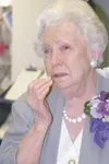 DIMITRA LAVRAKAS/Frontiersman Carlene Sanders is overcome by
emotion when she realizes that the people gathered at the Wasilla
Senior Center on Sunday, are there to honor her.
