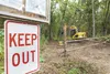 A keep out sign and locked gate block the entrance to Usibelli Coal Mine's Wishbone Hill access road near mile 55.5 of the Glenn Highway in this 2010 file photo. A lawsuit was filed Tuesday c