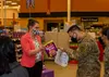 Marci McGill, the 673d Operational Medical Readiness Squadron Health Promotion dietician, asks U.S. Army Spc. Joel Melgar, a wheeled-vehicle mechanic assigned to the 4th Infantry Brigade Comb