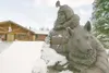 ROBERT DeBERRY/Frontiersman A bust of Joe Redington Sr. and his
dog stands outside Iditarod Headquarters off Knik-Goose Bay Road.
Redington is known as the father of the Iditarod Trail Sled D