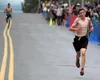 Palmer's Coby Marvin finishes ahead of Ali Papillon of Boulder, Colorado, to win the boys junior Mount Marathon Race on Monday, July 4, 2022, in Seward, Alaska. Jeff Helminiak/Peninsula Clari