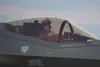 An F-35A Lightning II pilot with the 354th Fighter Wing renders a squadron salute after arriving at Marine Corps Air Station Iwakuni, Japan in support of Operation Iron Dagger, Dec. 3, 2021. 